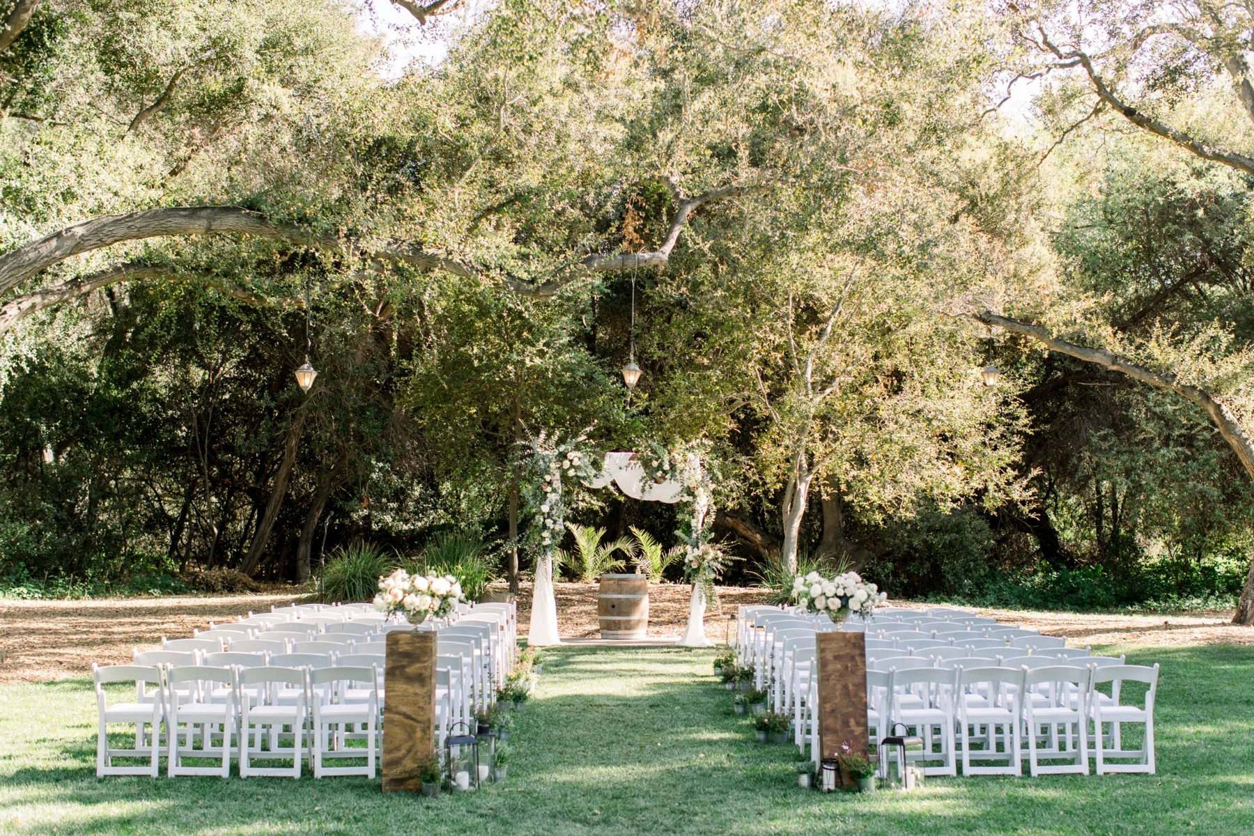 An outdoor ceremony beneath the oak trees at Temecula Creek Inn